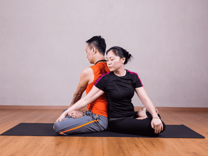 Partner Seated Twist Yoga Pose