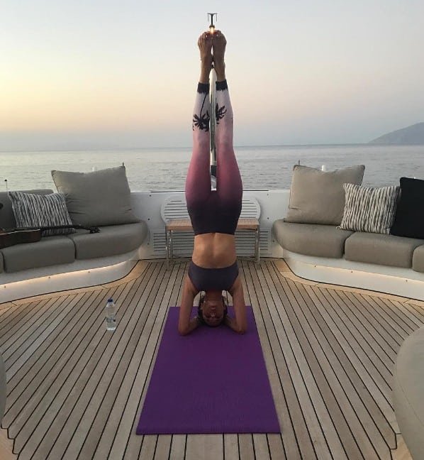 Alessandra Ambrosio doing headstand